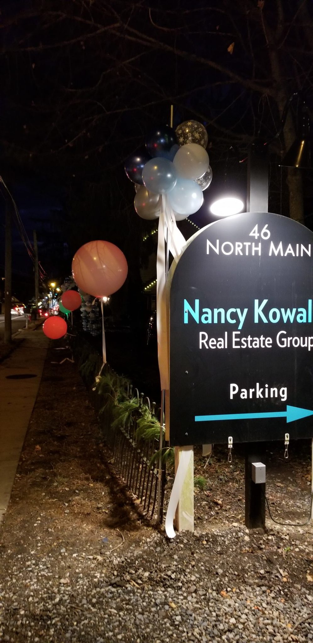Outdoor photo showing lighted balloons