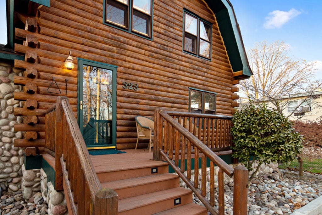 The front deck of the log cabin.