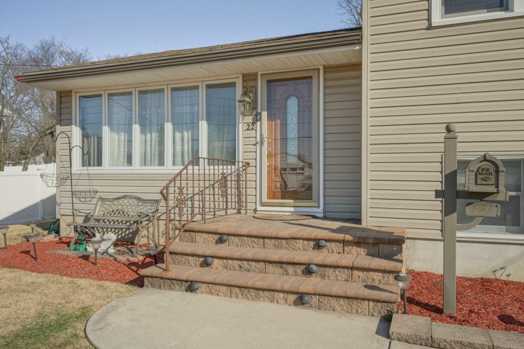 The paved front steps of 22 Alden Rd