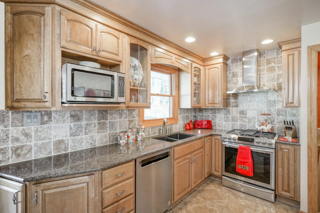 Kitchen of 22 Alden Rd with Granite Countertops and Maple Cabinetry