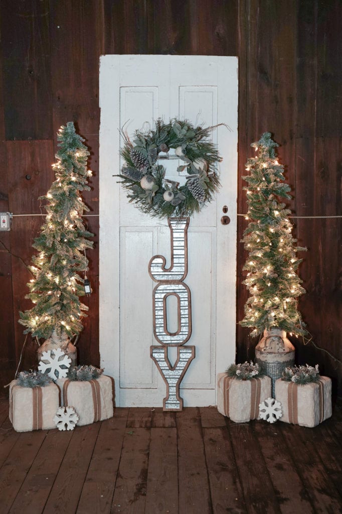 Barn door with wreath and joy on the door