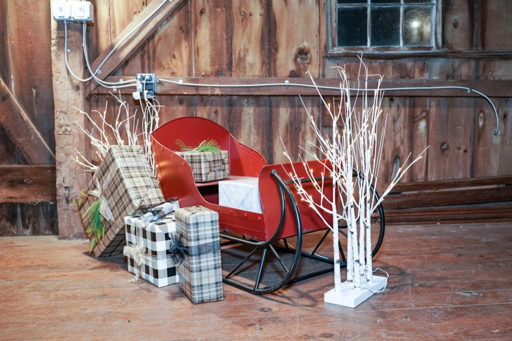 Red sleigh with holiday decorations