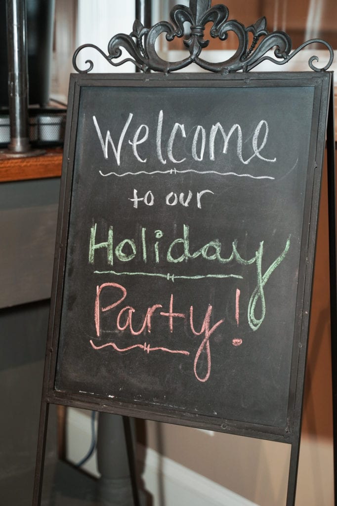 Chalkboard says Welcome to our Holiday Party