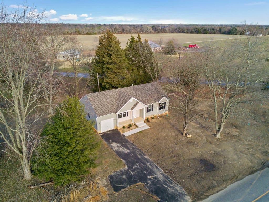 Mature trees dot the property of 464 Three Bridge Rd