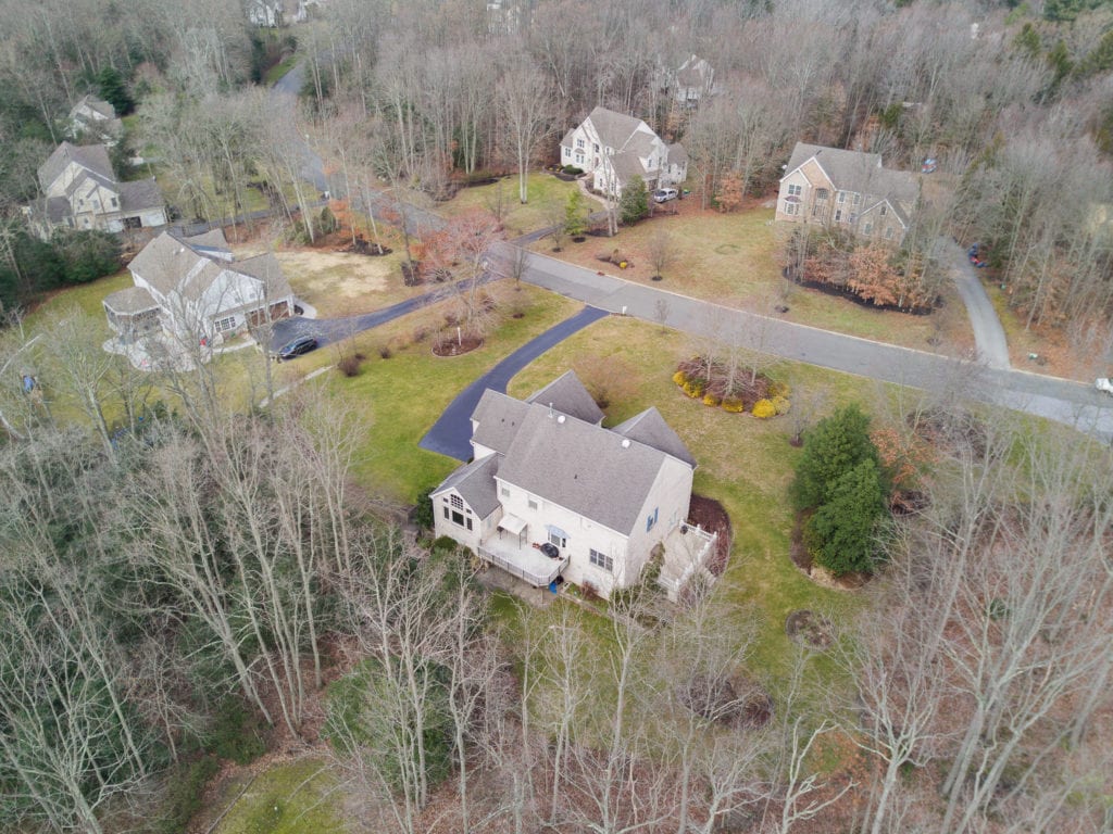 Aerial view showing patio, deck and lower patio
