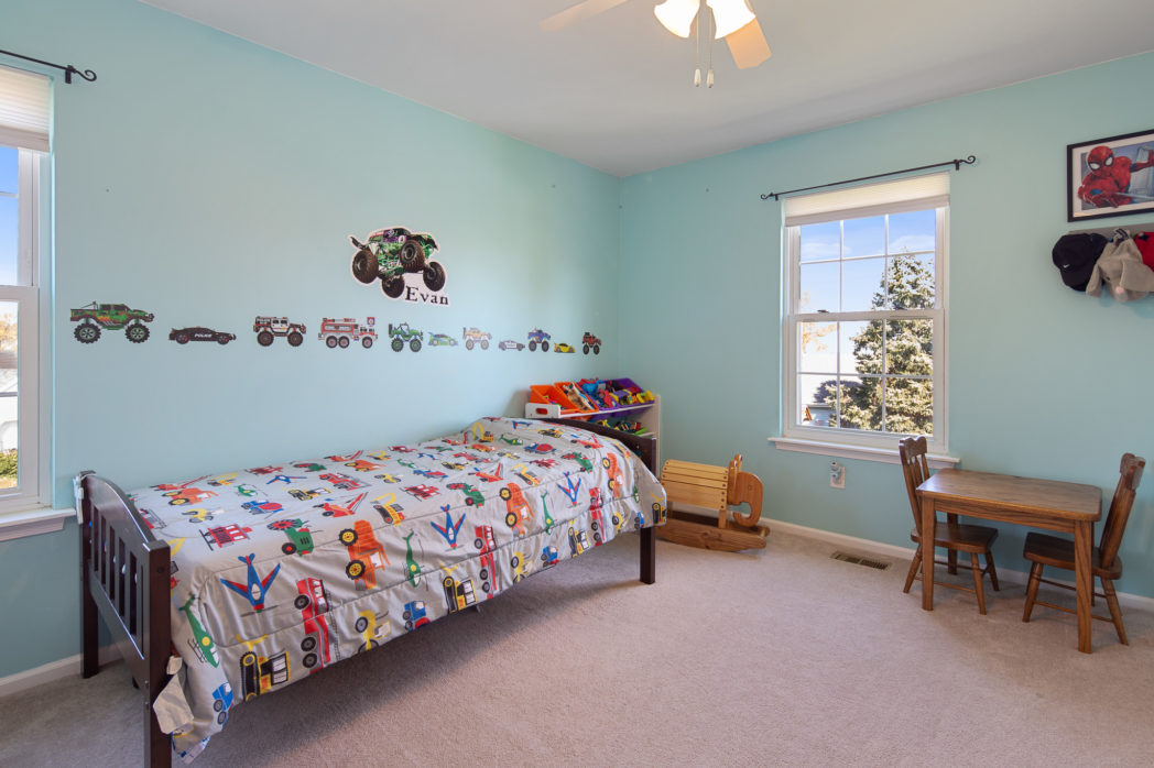 A sea foam colored bedroom