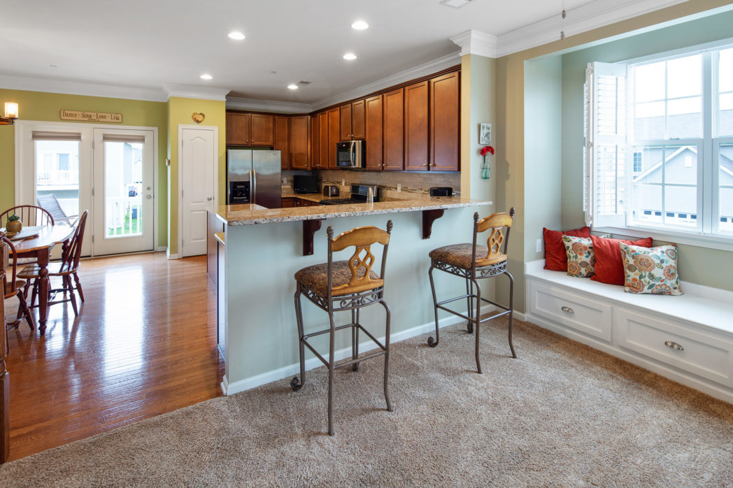 Photo shows breakfast bar and window seat