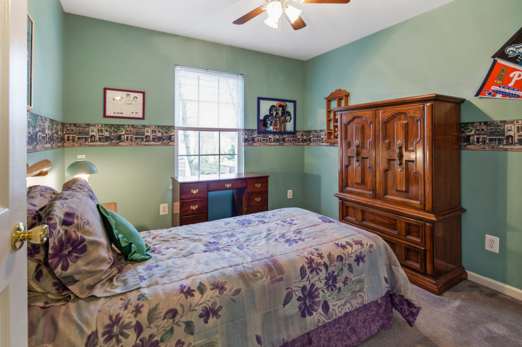 Bedroom with light green paint