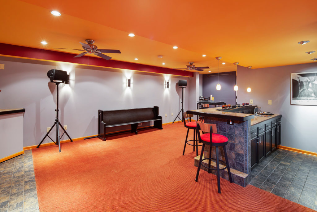 Basement features a wet bar and dramatic lighting package